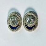 Oval Blue Stone Pave Halo Stud Earrings in Rhodium Silver