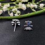 Playful Doll CZ Stud Earrings in Rhodium Silver - Image 2