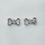 Playful Dog Bone Mother of Pearl Stud Earrings in Rhodium Silver