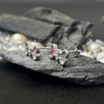 Playful Dog Bone Mother of Pearl Stud Earrings in Rhodium Silver - Image 2