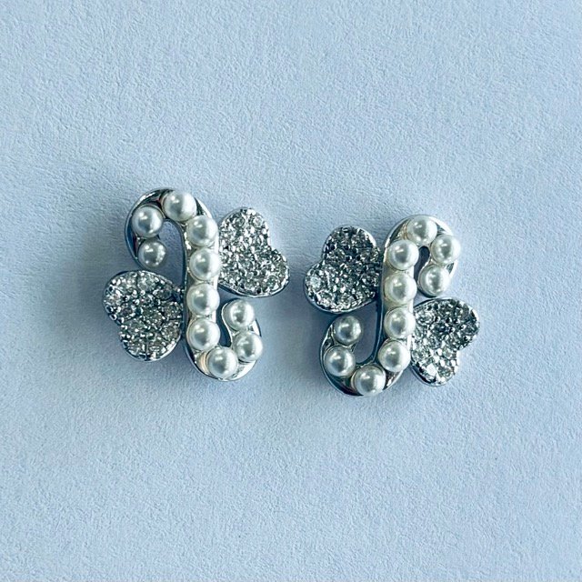 TPS-PE-013-1 Pave CZ Ribbon Knot Stud Earrings in Rhodium Silver - Image 1